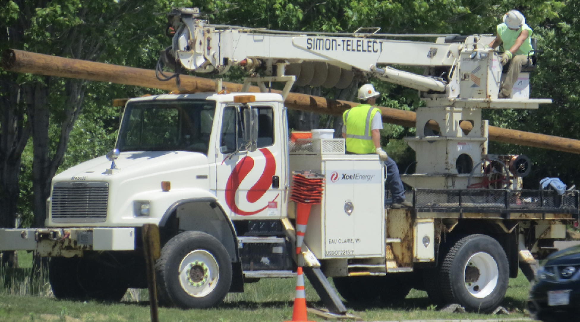 Xcel Energy truck with employees
