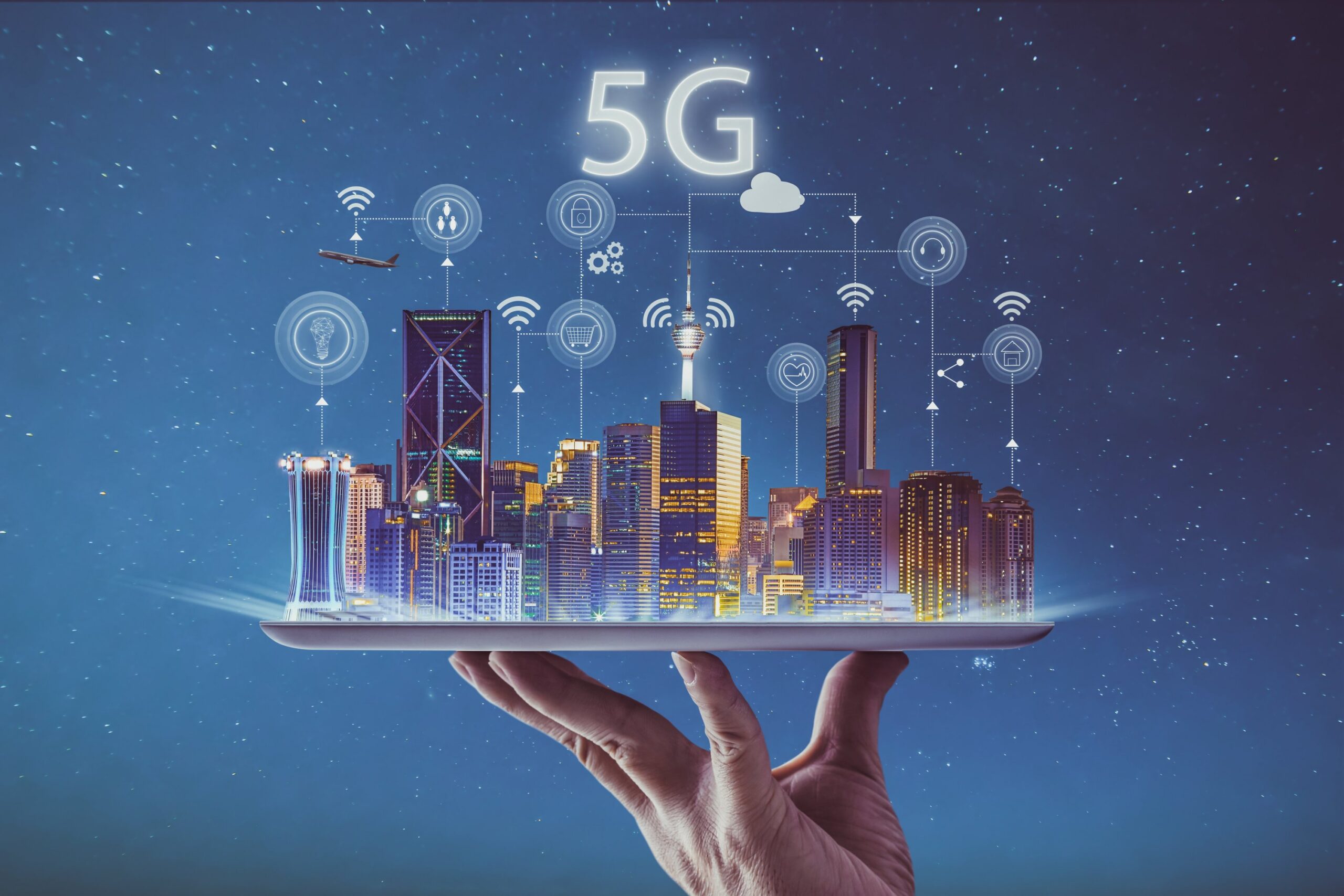 Conceptual illustration of a connected smart city on a tablet, with 5G text and icons representing wireless connectivity, cloud services, security, healthcare, and smart technology.